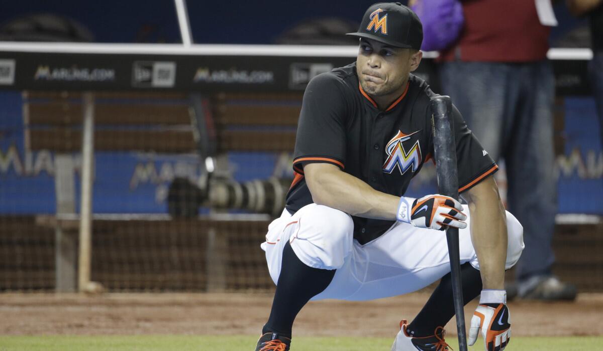 Miami Marlins' Giancarlo Stanton watches batting practice before a baseball game against the Philadelphia Phillies on Tuesday.