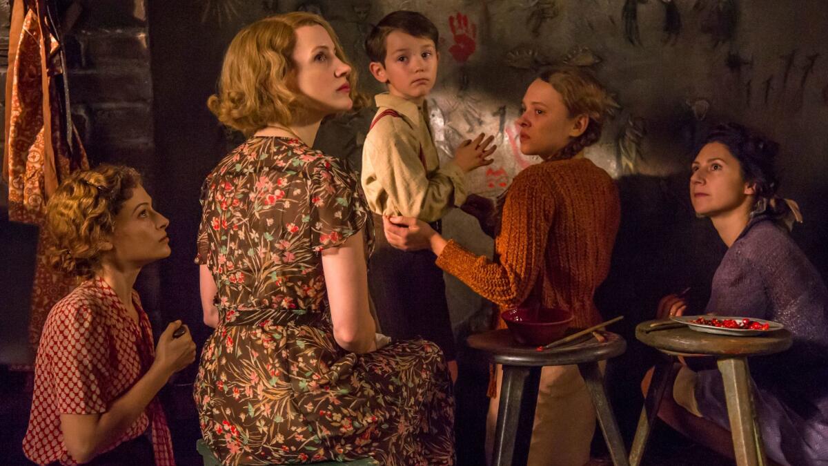 A scene from "The Zookeeper's Wife" with, from left, Efrat Dor, Jessica Chastain, Timothy Radford, Shira Haas and Martha Issova.