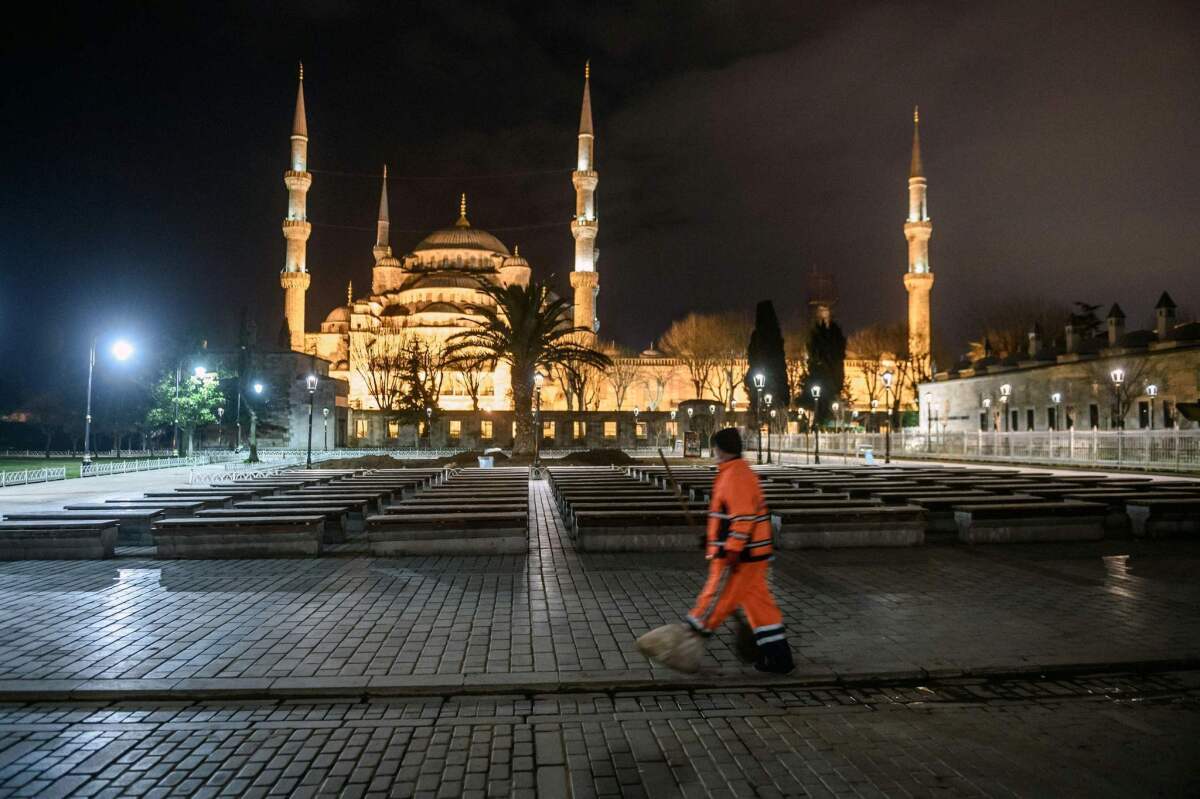 A city worker walks in Istanbul's tourist hub of Sultanahmet after a bomber attacked the area.