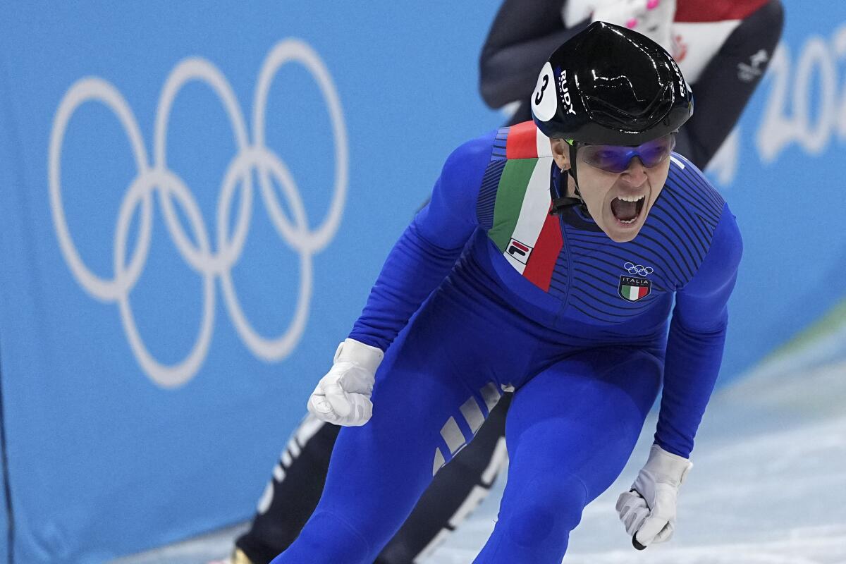Italy's Arianna Fontana celebrates after winning gold in the women's 500-meter.