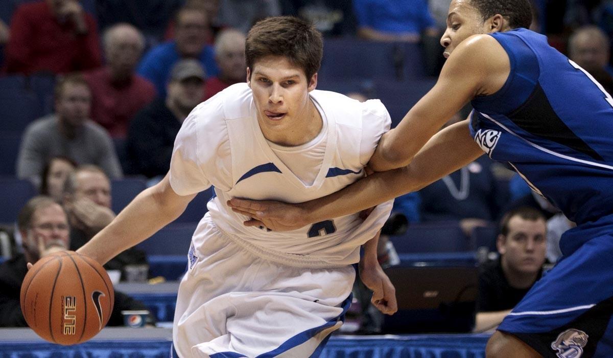 Creighton forward Doug McDermott drives against Drake's Jeremy Jeffers during a Missouri Valley Conference tournament game.