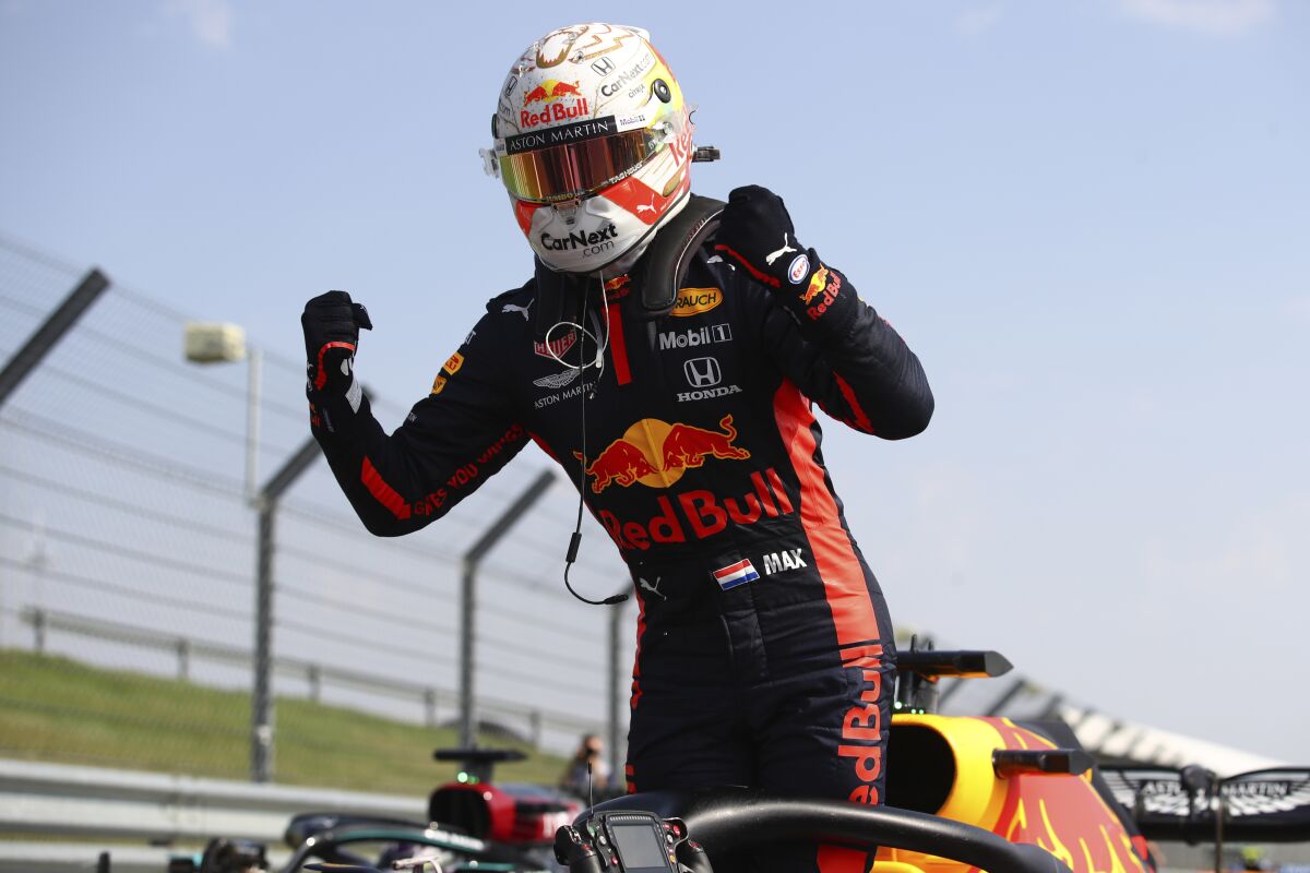 Max Verstappen celebrates after winning the 70th Anniversary Formula One Grand Prix.