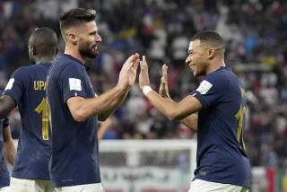 France's Olivier Giroud, left, and France's Kylian Mbappe celebrate after scoring their side's second goal.