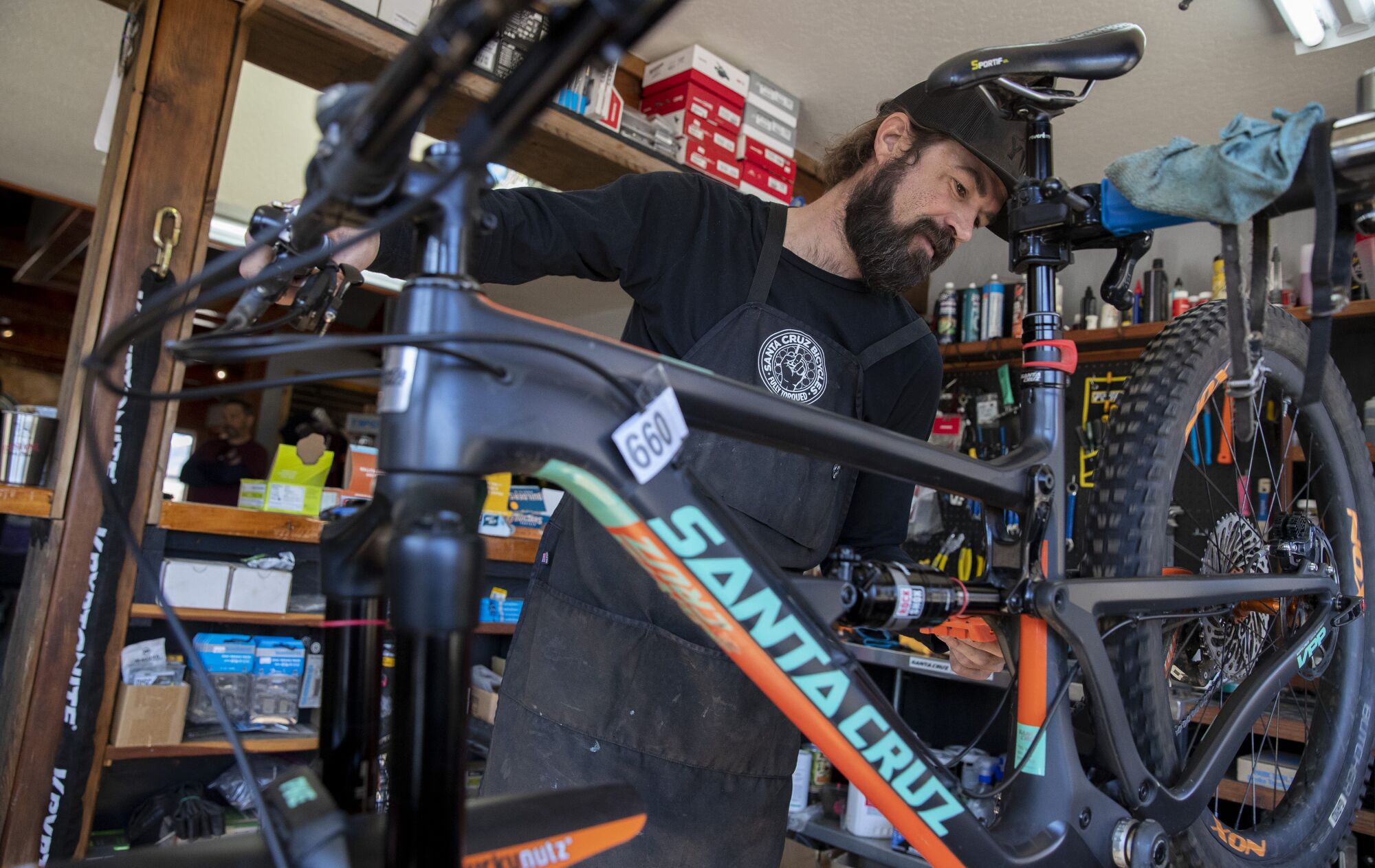A person works on a bike