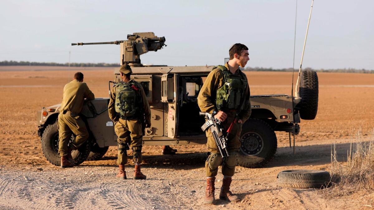 Israeli soldiers patrol near the Israeli border with the Gaza Strip on Oct. 30, 2017, near Kibbutz Kissufim in southern Israel.
