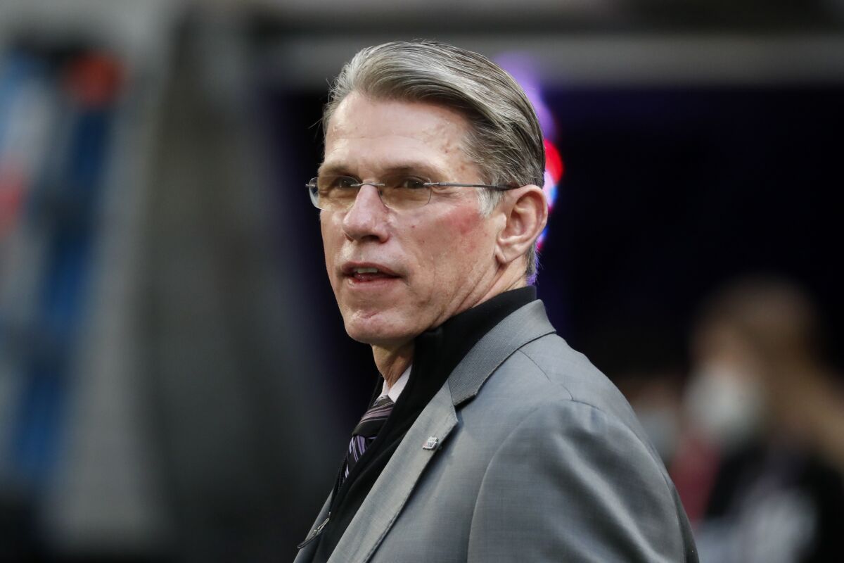 FILE - Minnesota Vikings general manager Rick Spielman stands on the field before an NFL football game against the Chicago Bears, Sunday, Jan. 9, 2022, in Minneapolis. The Minnesota Vikings fired general manager Rick Spielman and head coach Mike Zimmer on Monday, Jan. 10, 2022, according to a person with knowledge of the decision, after a second straight absence from the playoffs. The person spoke on condition of anonymity because the Vikings had not yet made the announcement.(AP Photo/Bruce Kluckhohn)