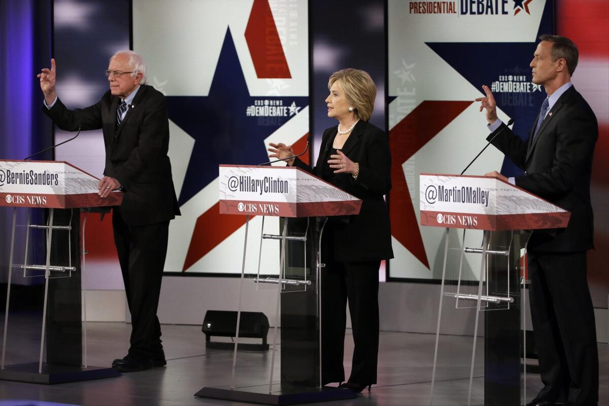 Democratic presidential candidates Bernie Sanders, left, Hillary Rodham Clinton and Martin O'Malley participate in a Democratic presidential primary debate, Saturday, Nov. 14, 2015, in Des Moines, Iowa. (AP Photo/Charlie Neibergall)