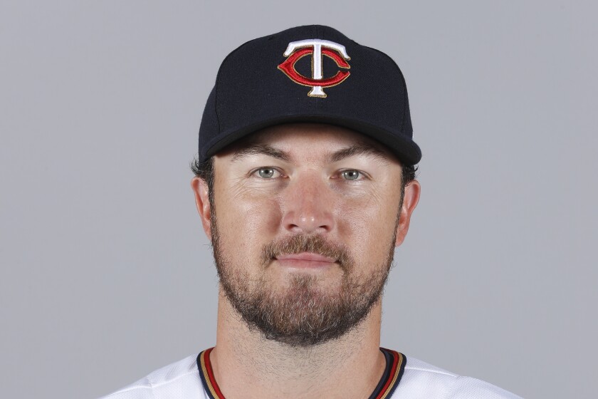 FILE - This is a 2018 file photo showing Minnesota Twins baseball player Phil Hughes. Phil Hughes has retired from baseball, more than two years after throwing his last pitch. The 34-year-old right-hander said on Twitter on Sunday, Jan. 3, 2021, he was announcing what's been “fairly apparent” to most of these last couple years.” (AP Photo/John Minchillo, File)