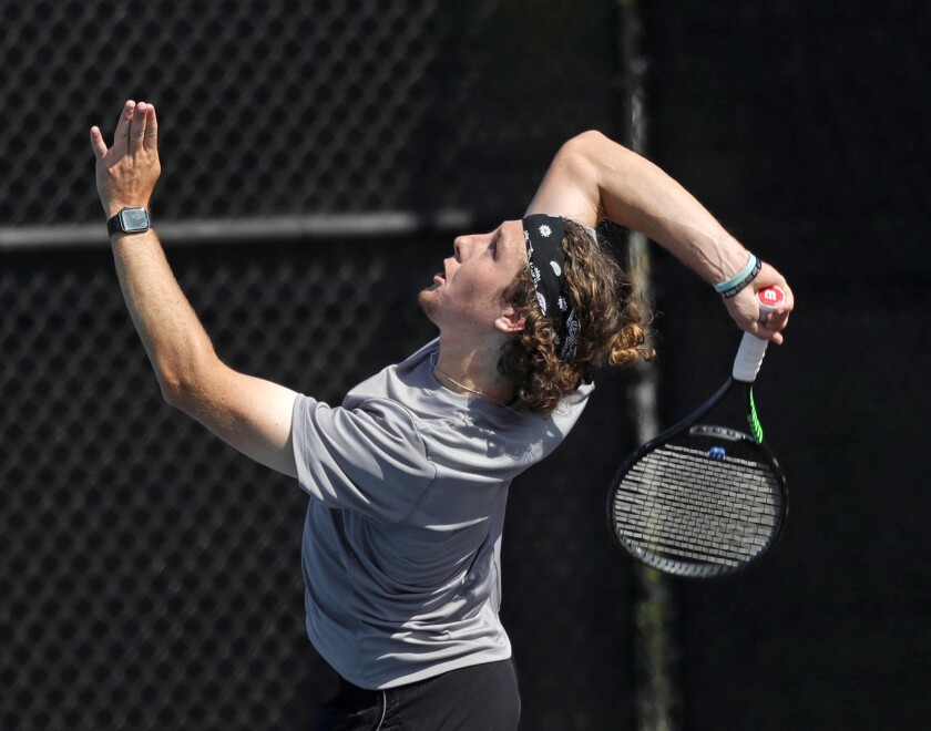 Laguna Beach's Peter Durand slams a volley winner against Edison on Monday.