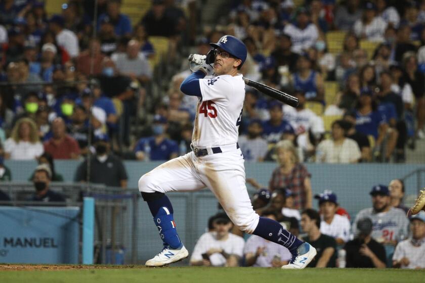 LOS ANGELES, CA - AUGUST 17, 2021: Los Angeles Dodgers first baseman Matt Beaty (45) hits a 2-run RBI double to give the Dodgers a 4-2 lead against the Pirates in the fifth inning at Dodger Stadium on August 17, 2021 in Los Angeles, California.(Gina Ferazzi / Los Angeles Times)
