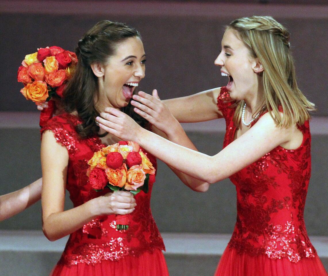 Princess Katherine Lipp, right, reaches to embrace Ana Acosta, left, after her name was announced as the 2014 Rose Queen at the announcement and coronation of the 2014 Tournament of Roses Rose Queen at First Church of the Nazarene of Pasadena on Thursday, October 24, 2013. The Rose Queen is Ana Acosta of Polytechnic School in Pasadena. (Tim Berger/Staff Photographer)