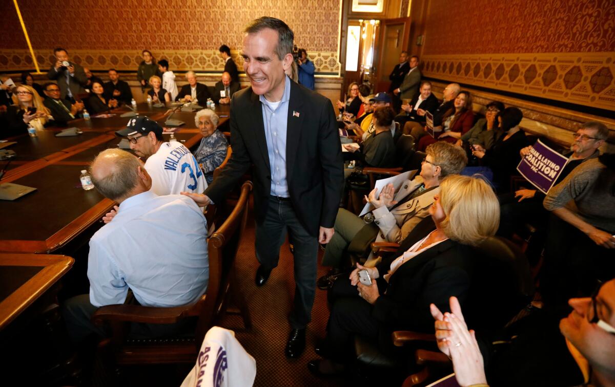 Los Angeles Mayor Eric Garcetti arrives at a meeting with the Asian and Latino Coalition at the Statehouse in Des Moines in April.