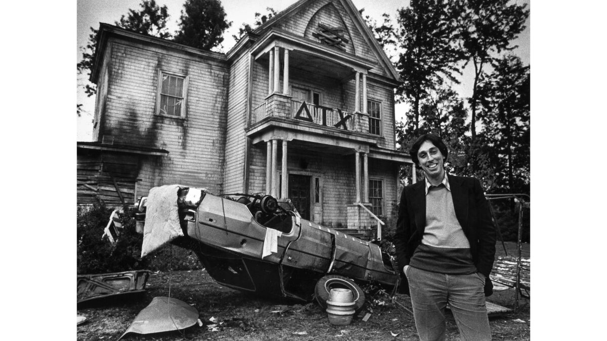 Jan. 23, 1979: Ivan Reitman, co-producer of "Animal House," poses before the fraternity house edifice constructed at Universal Studios for the spinoff television show "Delta House."