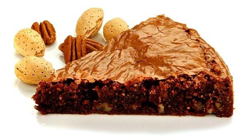 Rich with chocolate flavor. Recipe: Chocolate pecan brownie fudge cake