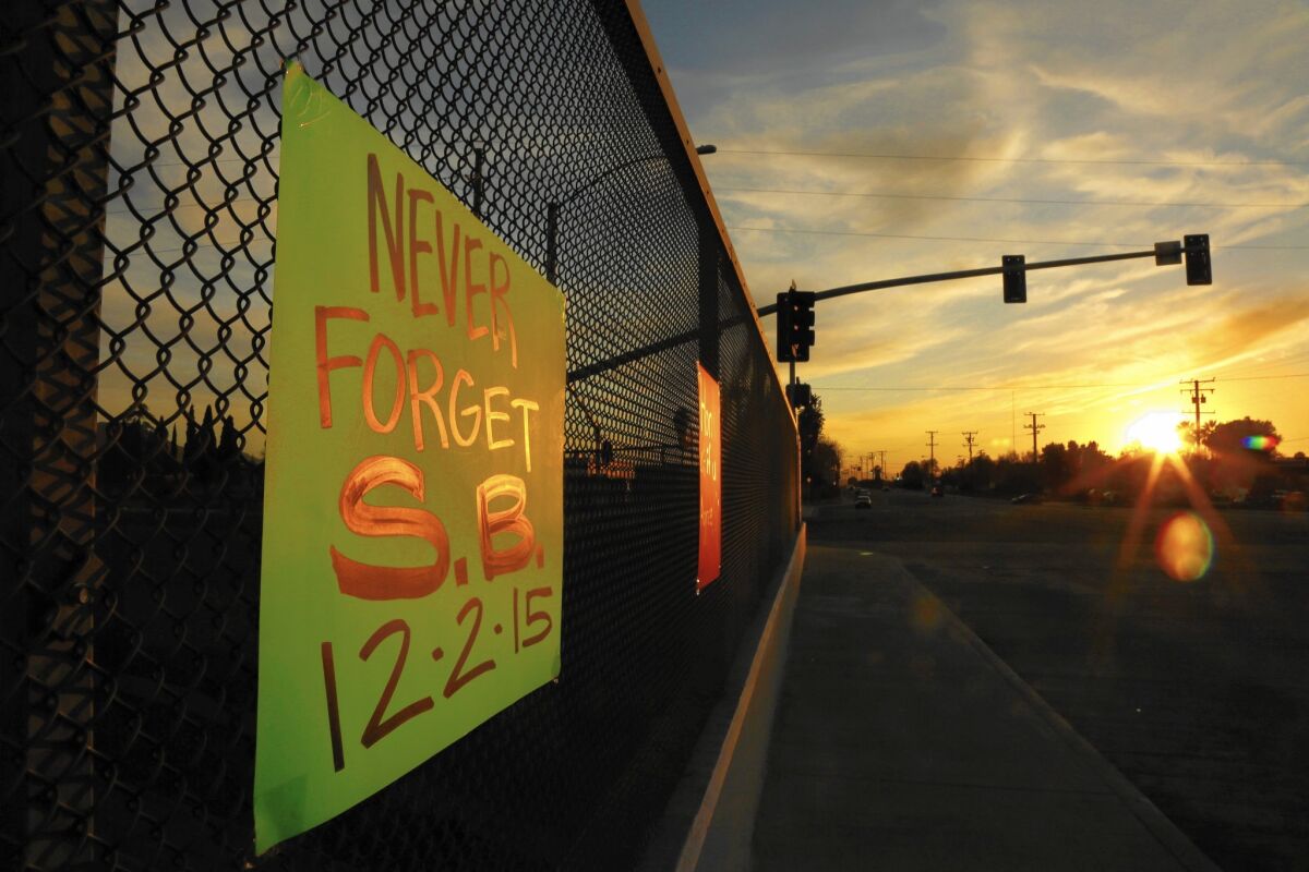 One of several signs supporting the city of San Bernardino hangs above the 215 Freeway on Dec. 6.
