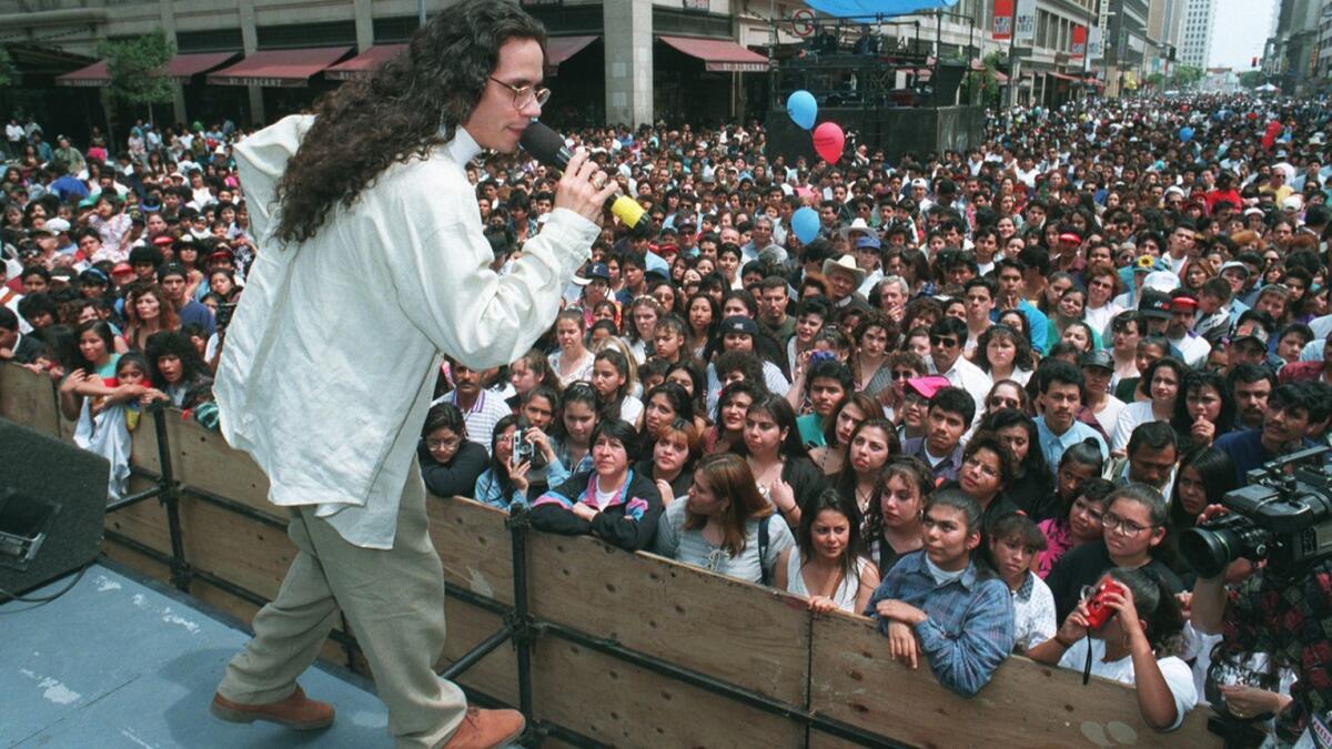 Marc Anthony entertains a downtown L.A. crowd in the 1990s. (Bob Carey / Los Angeles Times)
