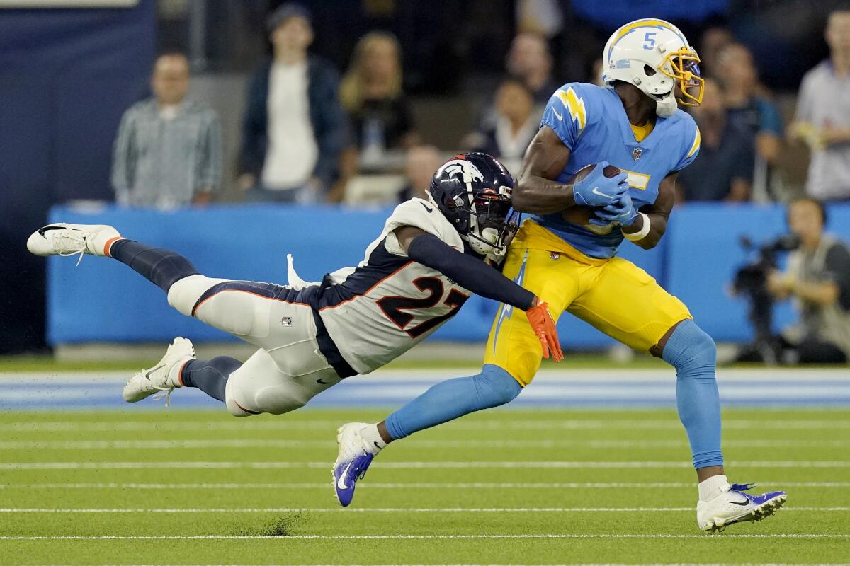 Chargers wide receiver Joshua Palmer makes a catch in front of Denver Broncos cornerback Damarri Mathis.