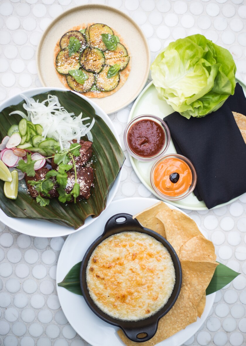 Three dishes at Camino Riviera restaurant in Little Italy