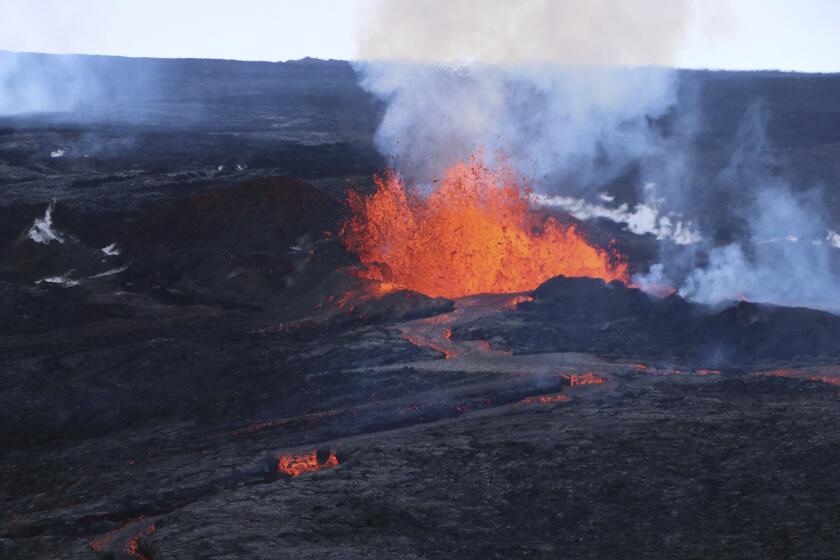 This aerial image courtesy of Hawaii Dept. of Land and Natural Resources shows lava flows on Mauna Loa, the world's largest active volcano, on Wednesday, Nov. 30, 2022, near Hilo, Hawaii. (Hawaii Dept. of Land and Natural Resources via AP)
