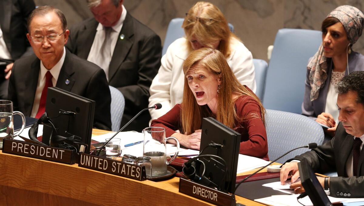 Samantha Power, center, United States' ambassador to the United Nations, speaks while Secretary-General Ban Ki-moon, left, listens during a U.N. Security Council meeting about Ebola.