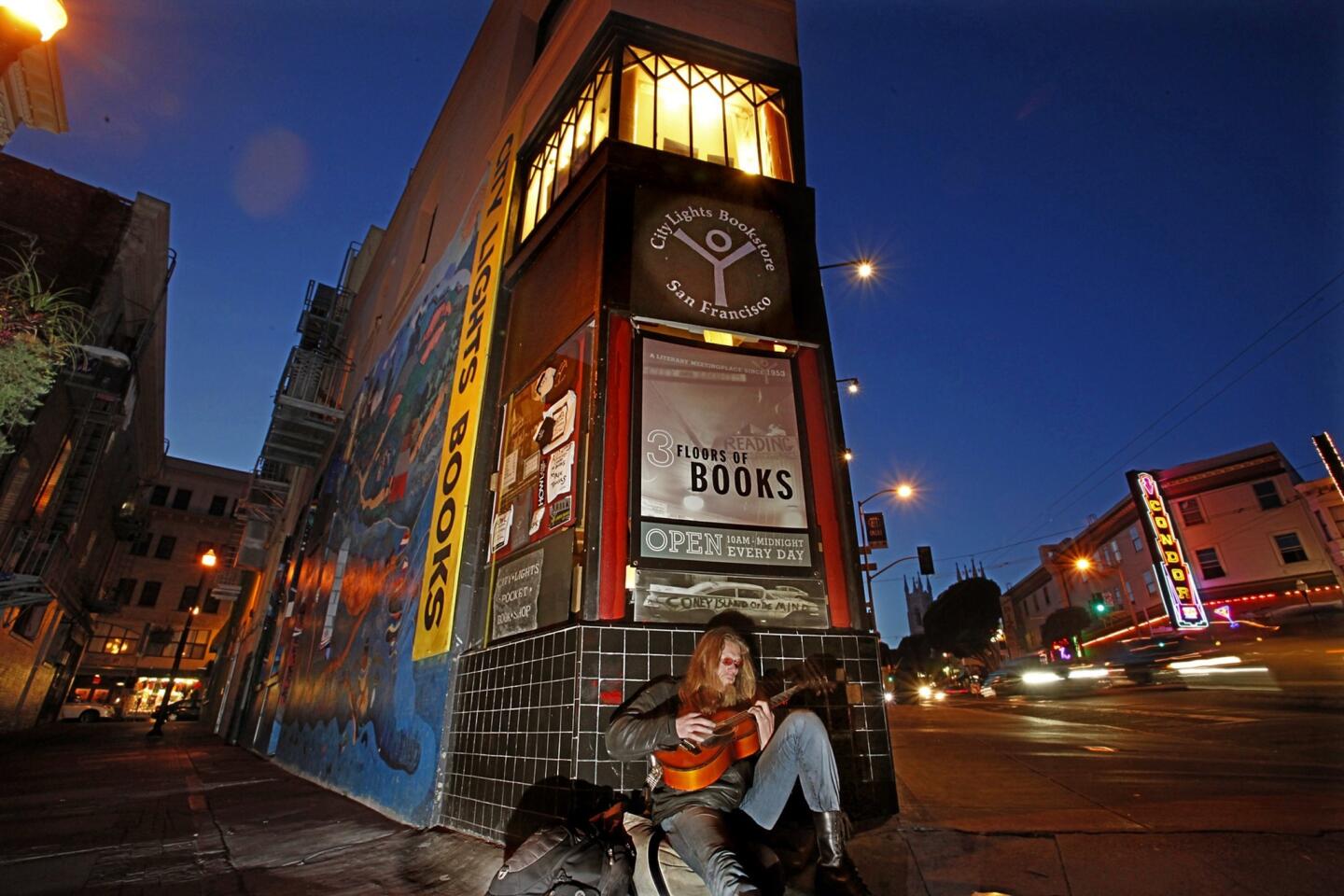 Guitar player outside City Lights