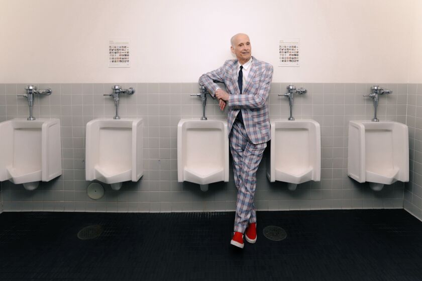 LOS ANGELES, CA - MAY 10, 2022 - - Ladies and gentlemen the, "Pope of Trash" and the "King of Puke," director John Waters strikes an elegant form before a discussion and book signing for his first book of fiction, "Liarmouth," at the Aratani Theater in Los Angeles on May 10, 2022. Waters has written several non-fiction books like, "Carsick," "Make Trouble," "Role Models," and "Mr. Know-It-All.:" Waters has been a film provocateur and camp legend for years with films such as, "Pink Flamingos," Female Trouble," "Cry Baby," "Polyester," "Hairspray," "Pecker," and "Serial Mom." (Genaro Molina / Los Angeles Times)