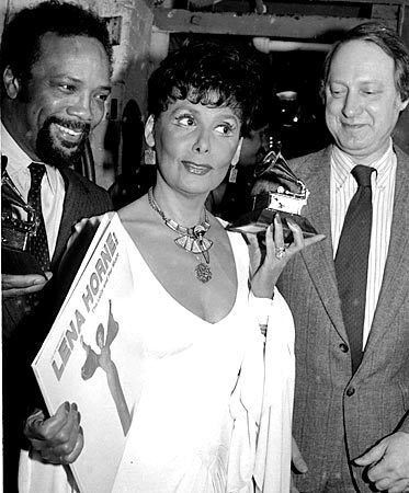 Lena Horne with record producer Quincy Jones, left, holding his Grammy, and Dan Morgenstern of the National Academy of Recording Arts and Sciences as she displays her Grammy and the record that earned it, in New York in 1982.