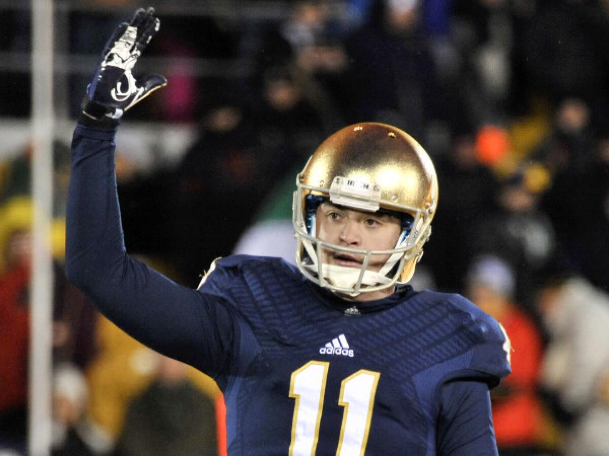 Notre Dame quarterback Tommy Rees encourages the students in the final seconds of the Fighting Irish's 23-13 victory over BYU on Saturday.