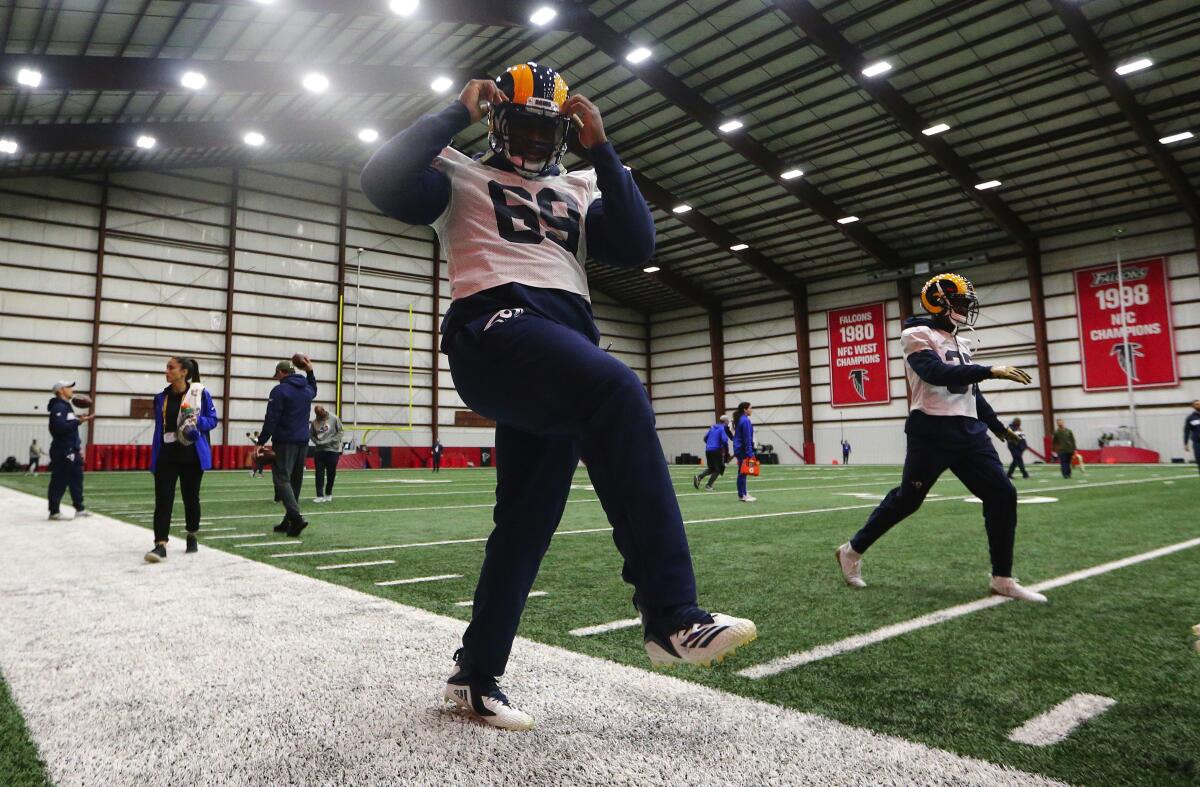 Rams defensive tackle Sebastian Joseph-Day stretches during a Super Bowl LIII practice session in 2019.