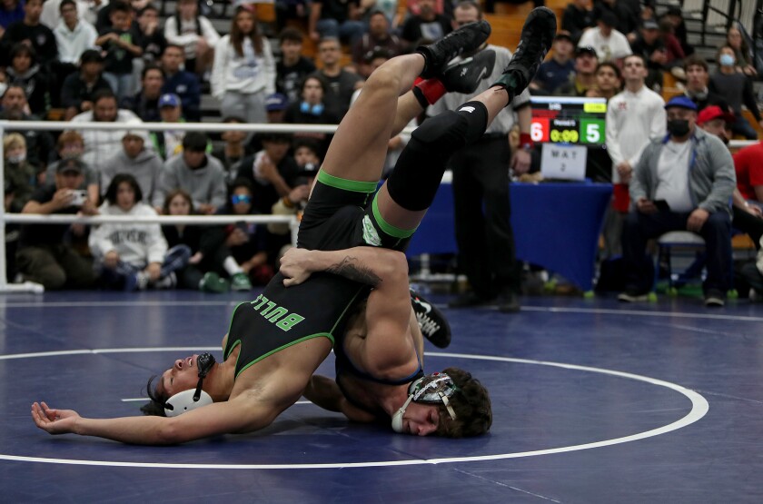 Fountain Valley's Zach Parker, right, wrestles in the 145-pound championship match during the Five Counties Tournament.