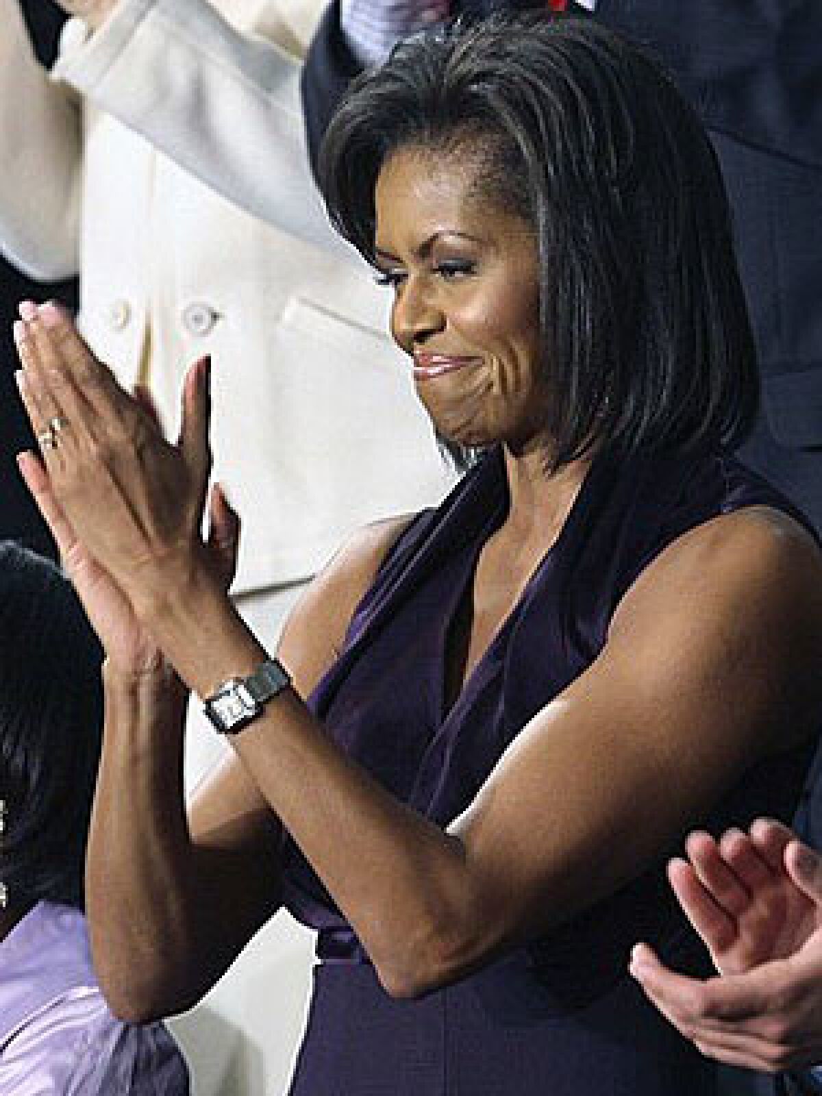 FIT: First Lady Michelle Obamas sleeveless look shows off her toned arms.