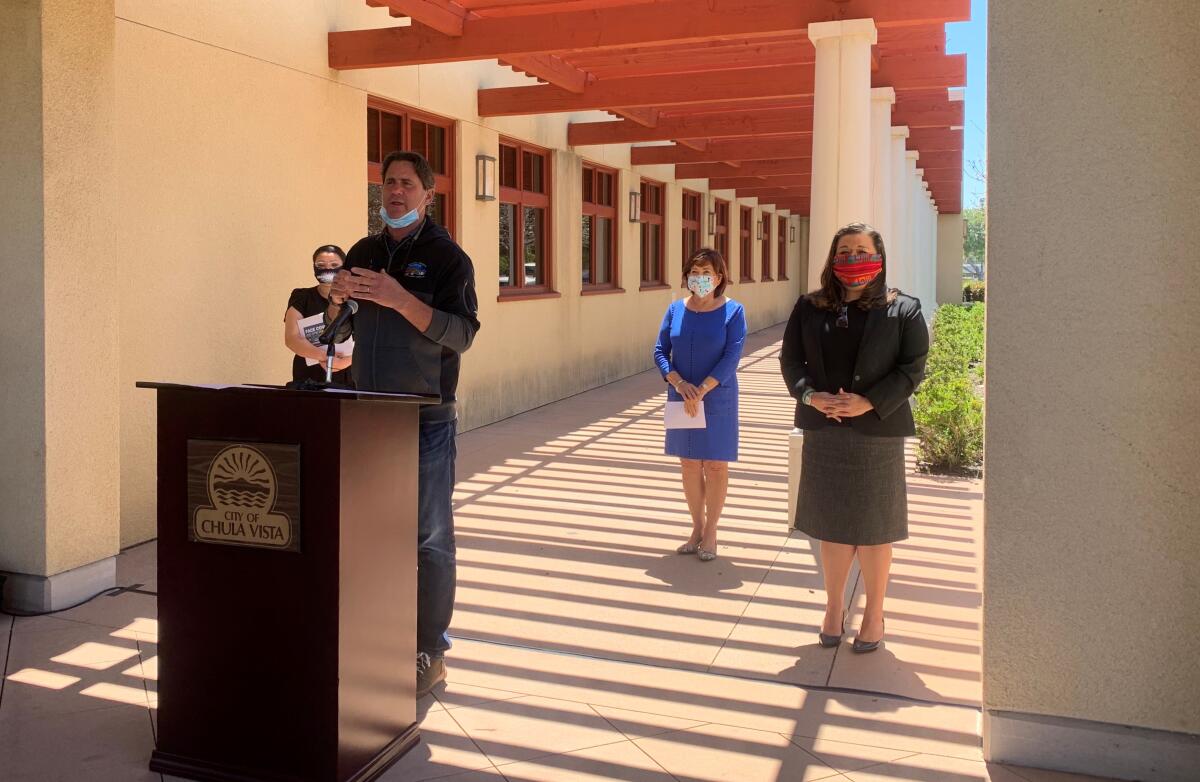 Imperial Beach Mayor Serge Dedina asks the County to increase testing. In the background, Mayors Mary Casillas Salas and Alejandra Sotelo-Solis, as well as San Diego Councilwoman Vivian Moreno all wear protective facemasks while standing six feet apart from each other.