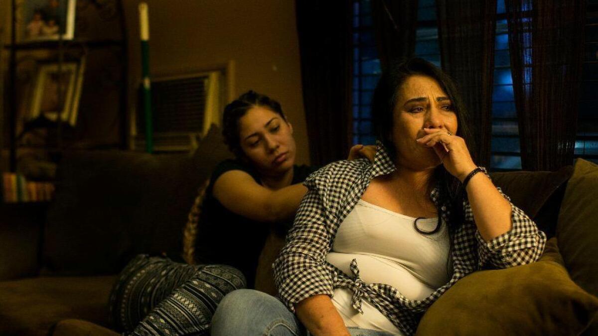 Guadalupe Plascencia, right, is consoled by her daughter Mahria Torres.