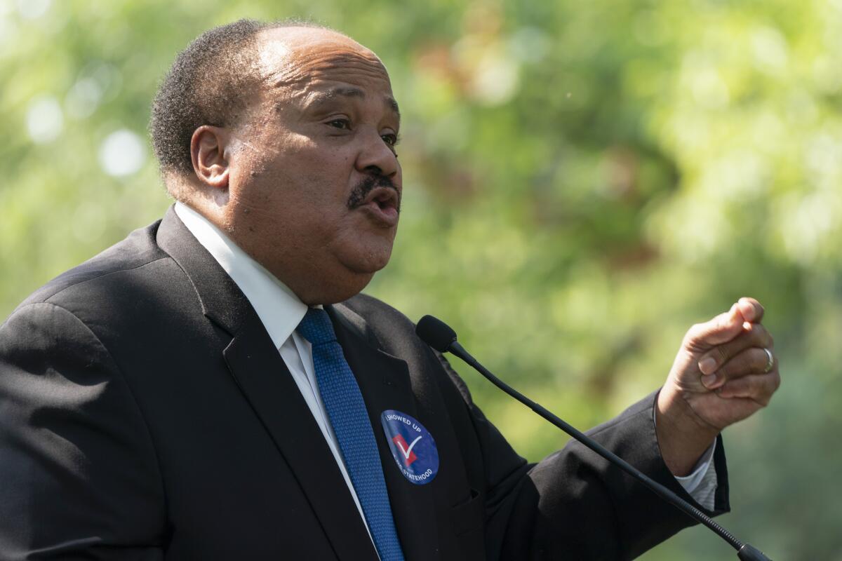 Martin Luther King III speaks at a microphone