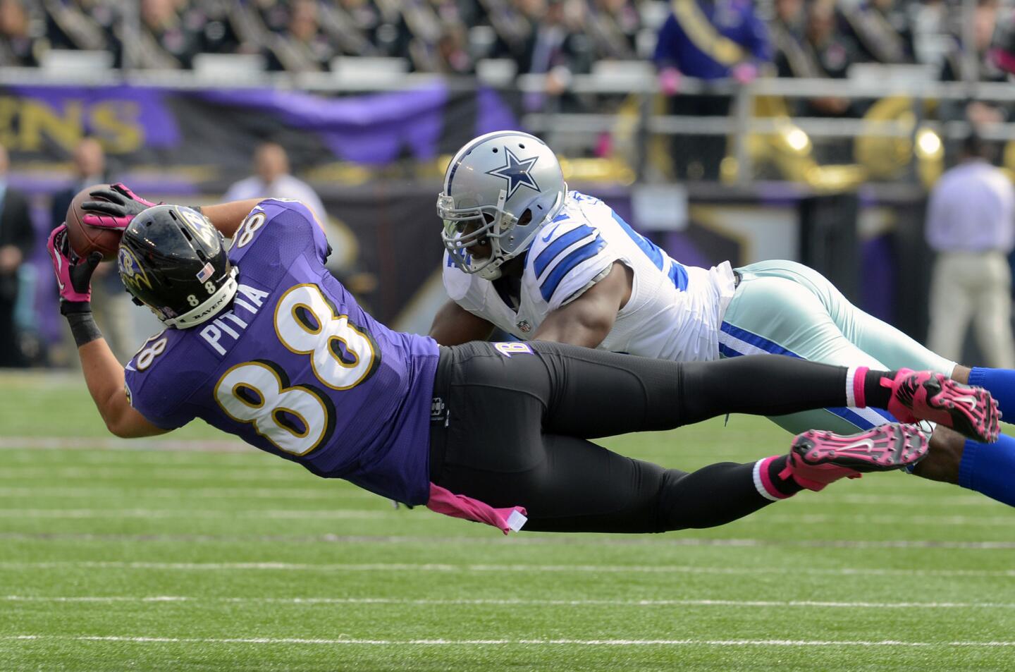 Tight end Dennis Pitta dove, twisted his body and stretched out his arms and hands for an acrobatic sideline catch against the Dallas Cowboys. Honorable mention: Anquan Boldin's back-of-the-end zone grab where he tapped his feet inbounds for a 34-yard touchdown against the Cincinnati Bengals.