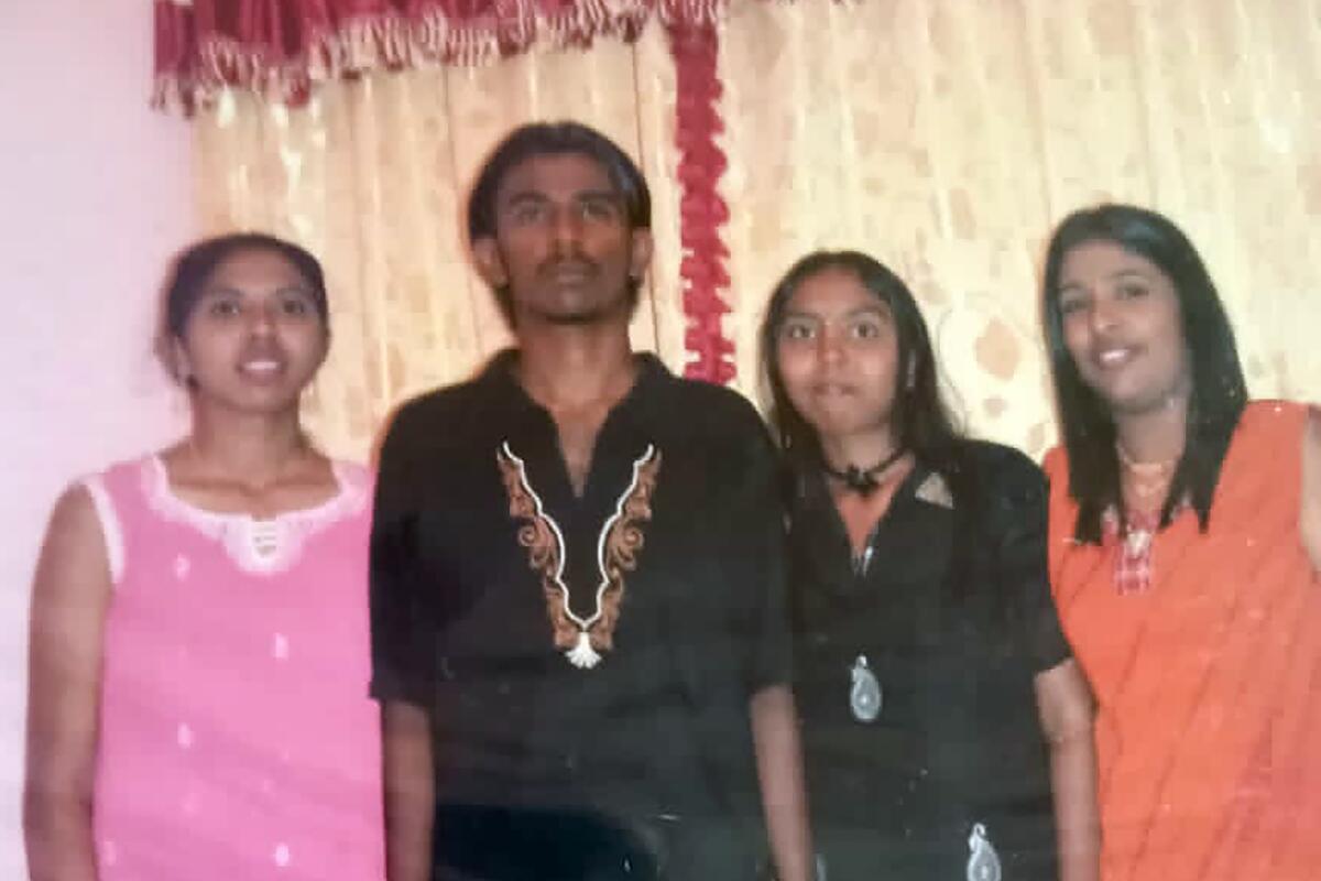 This undated photo provided by Sarmila Dharmalingam, right, shows her younger brother Nagaenthran K.Dharmalingam, second from left, with their cousins in Ipoh, Malaysia. Singapore's High Court on Monday, Nov. 8, 2021, halted the imminent execution of Nagaenthran, believed to be mentally disabled, amid pleas from the international community and rights groups. (Sarmila Dharmalingam via AP, File)