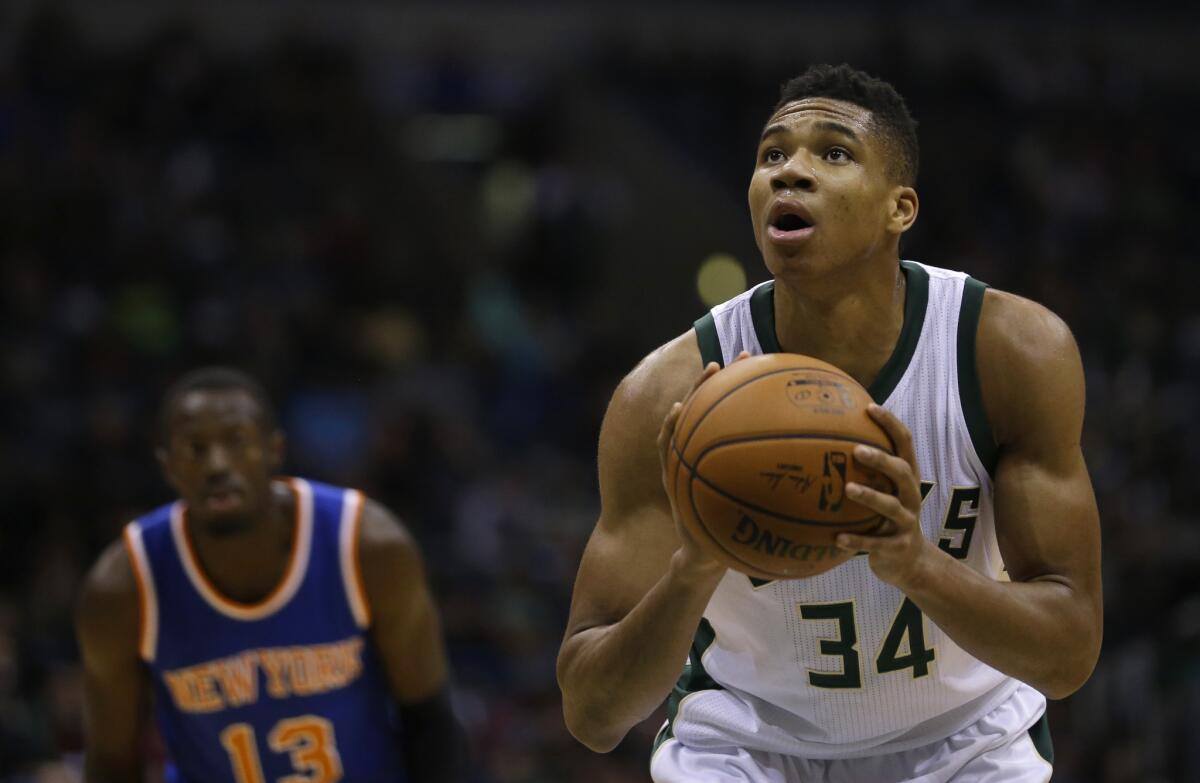 Giannis Antetokounmpo leads the Bucks with a career-high 16 points a game.