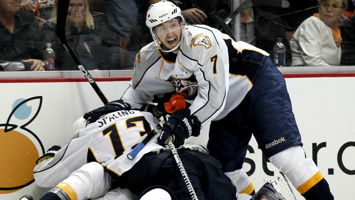 Jonathon Blum (7) joins Predators teammates in celebrating an overtime victory against the Ducks in the 2011 playoffs.