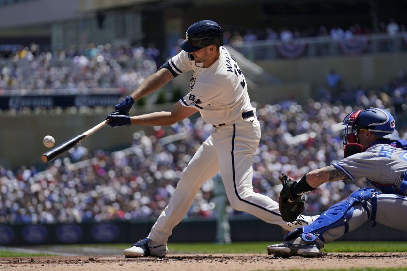 Minnesota Twins' Matt Wallner hits an RBI-single during the first inning of a baseball game against the Toronto Blue Jays, Saturday, May 27, 2023, in Minneapolis. (AP Photo/Abbie Parr)