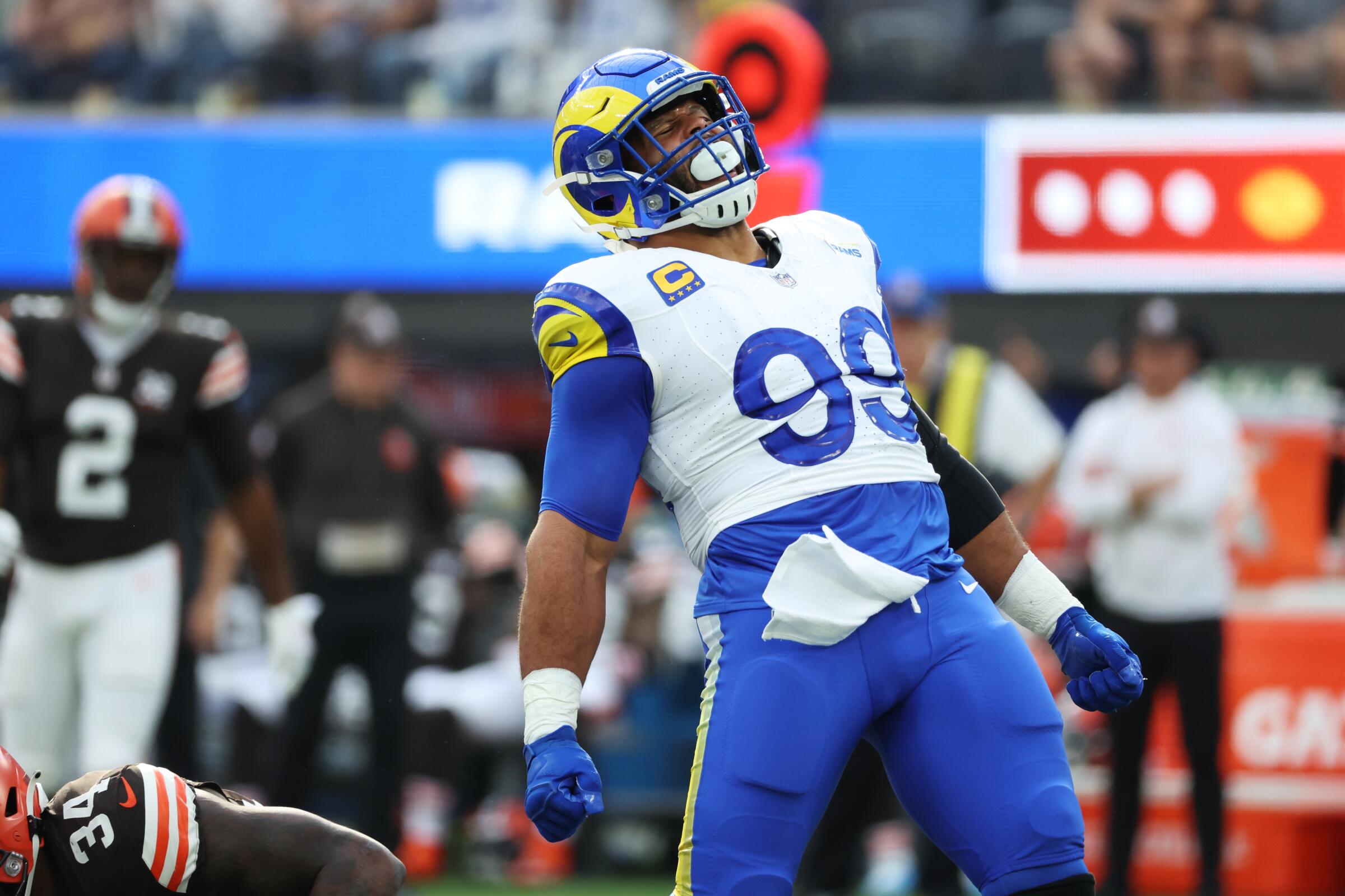 The Rams' Aaron Donald celebrates his tackle of Browns back Jerome Ford for a loss. 