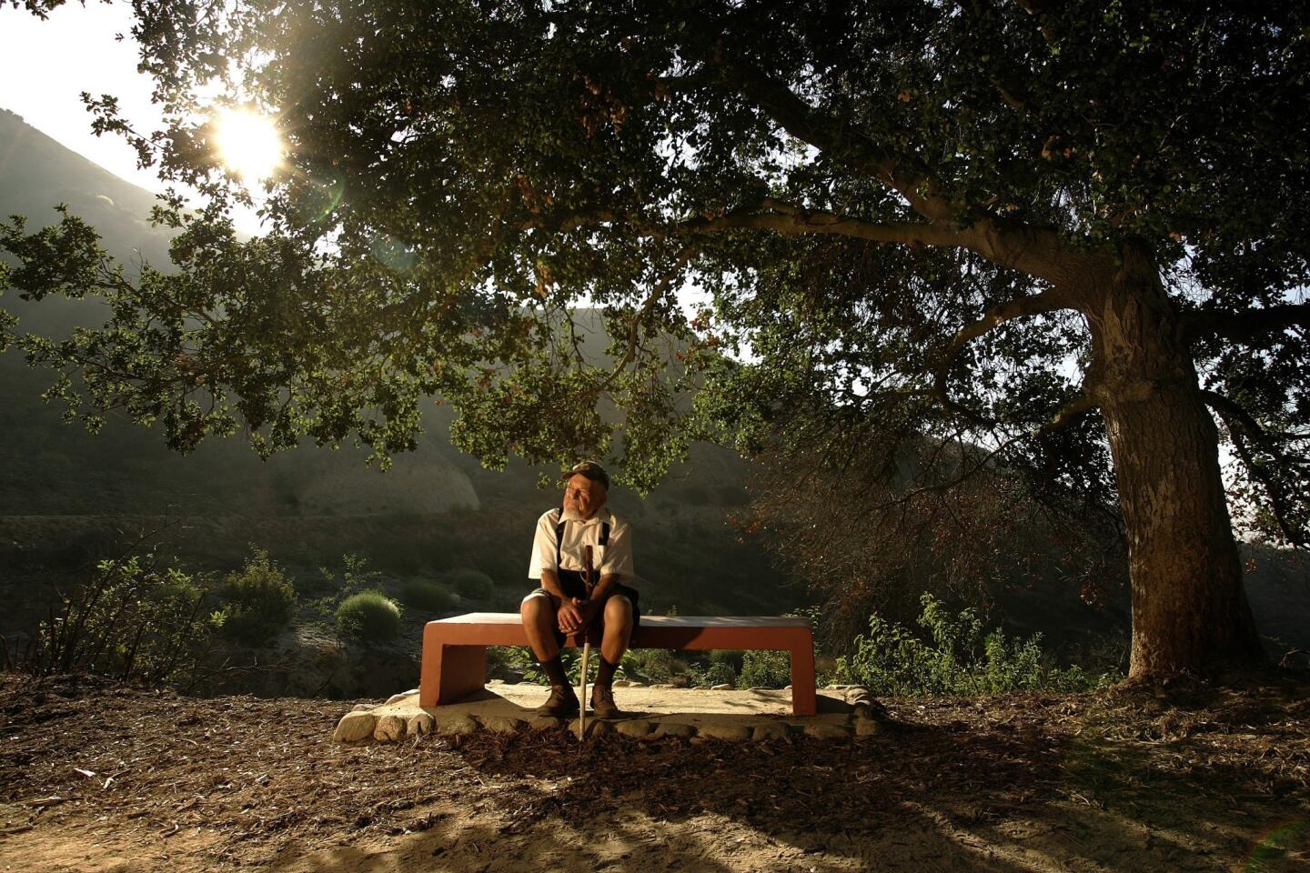 Sol Shankman, in 2008 on a bench dedicated to him, is believed to have walked the equivalent of the Earth's circumference within Griffith Park. He began his daily walks in the early 1980s.