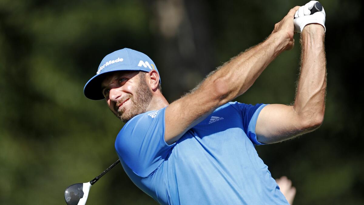 Dustin Johnson follows through on his tee shot at No. 12 during the second round of the Tour Championship on Friday.