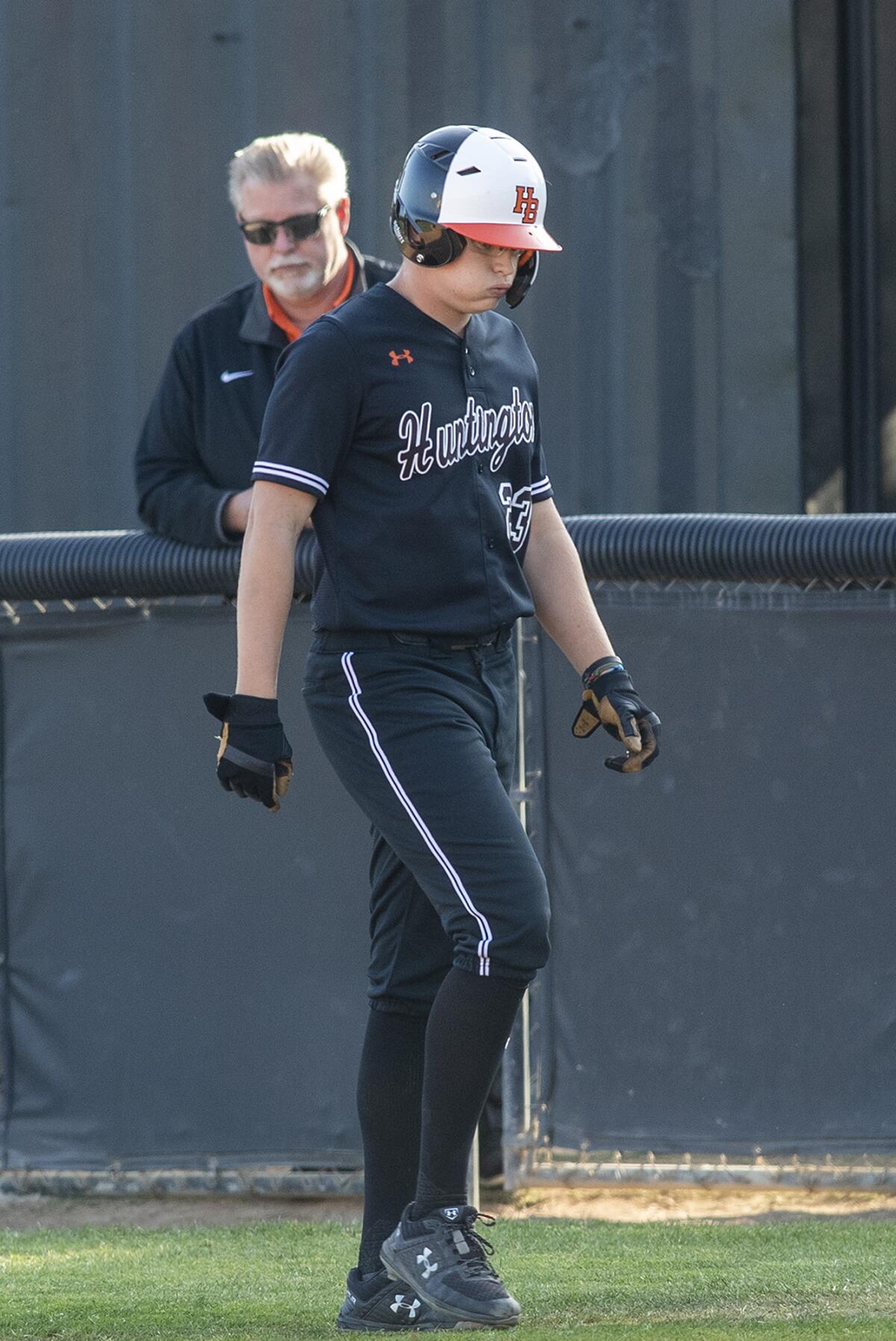 Huntington Beach's Ethan Porter sighs after grounding out for the final out of Tuesday's game.