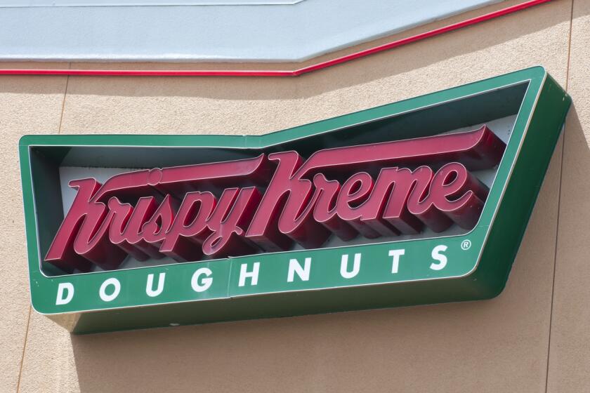 Sign on the exterior of a Krispy Kreme Doughnuts store.