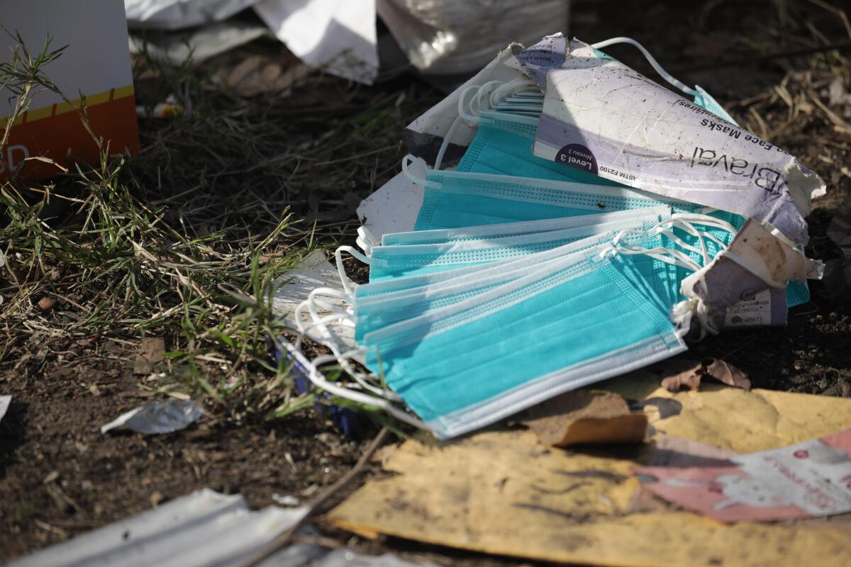 A discarded box of face masks.