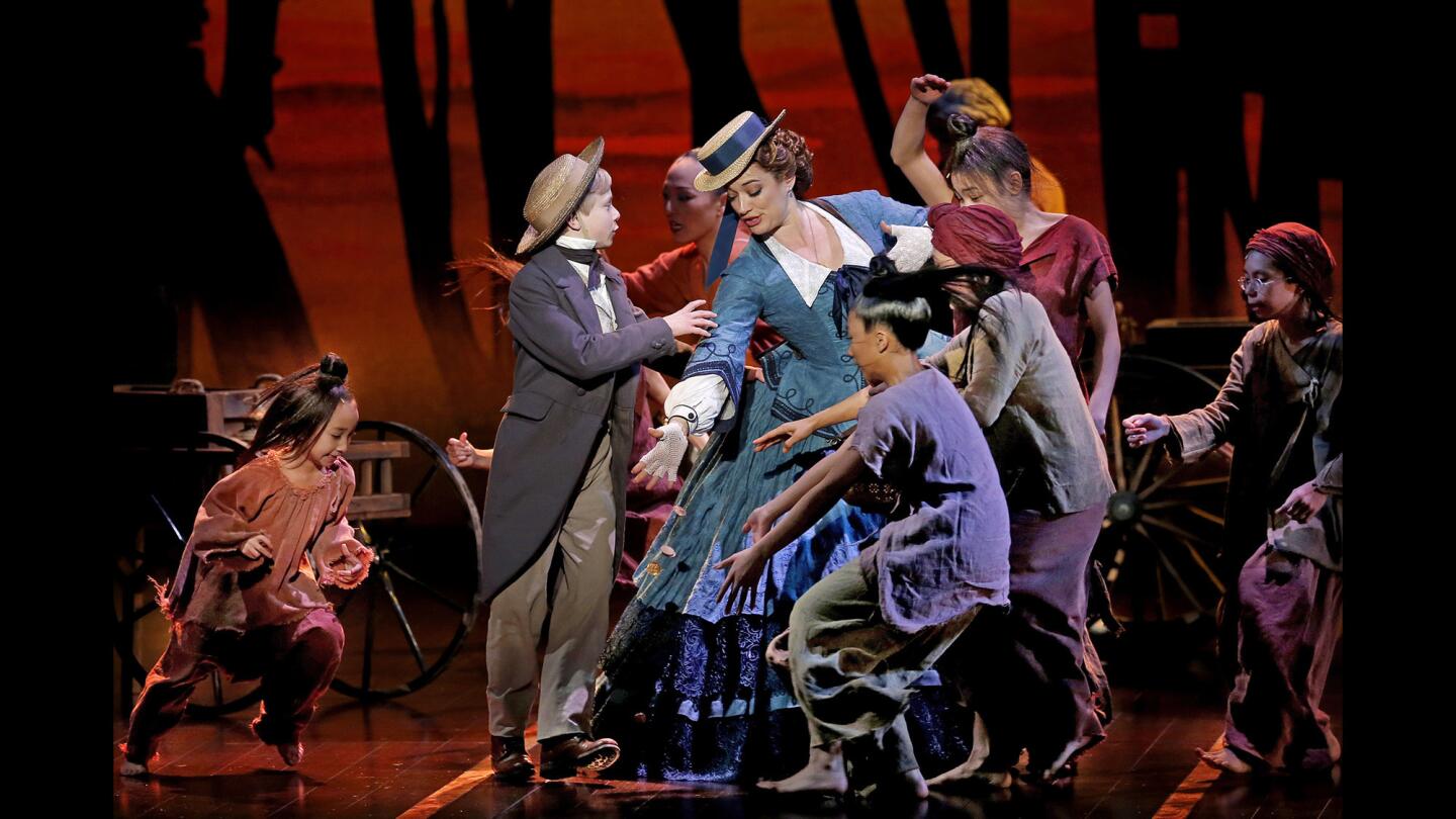 Graham Montgomery and other child actors perform with Laura Michelle Kelly in "The King and I" at the Pantages Theatre.