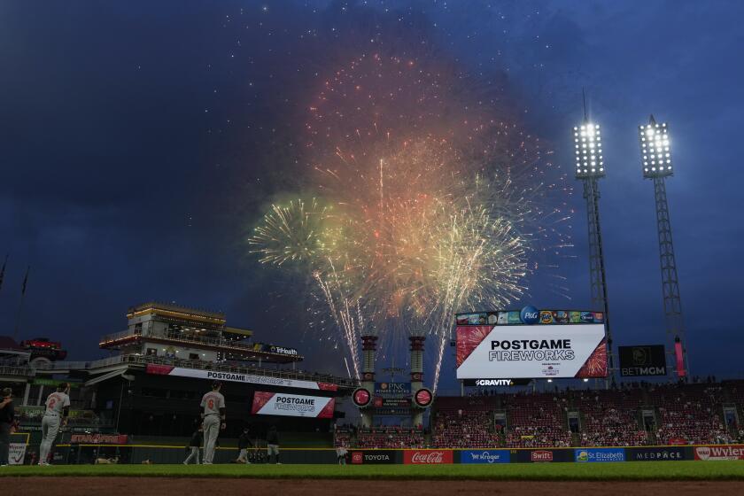 Fireworks explode above the Great American Ball Park before a baseball game between the Baltimore Orioles and the Cincinnati Reds, Friday, May 3, 2024, in Cincinnati. The postgame fireworks were fired before the game because of the rain delay. (AP Photo/Carolyn Kaster)