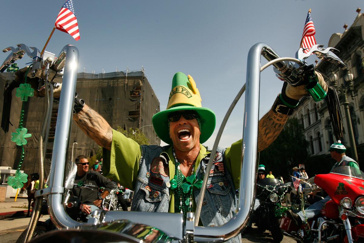 John O'Connor, president of the LAFD Hogs motorcycle group, gets revved up for the St. Patrick's Day parade through downtown Los Angeles in 2009.