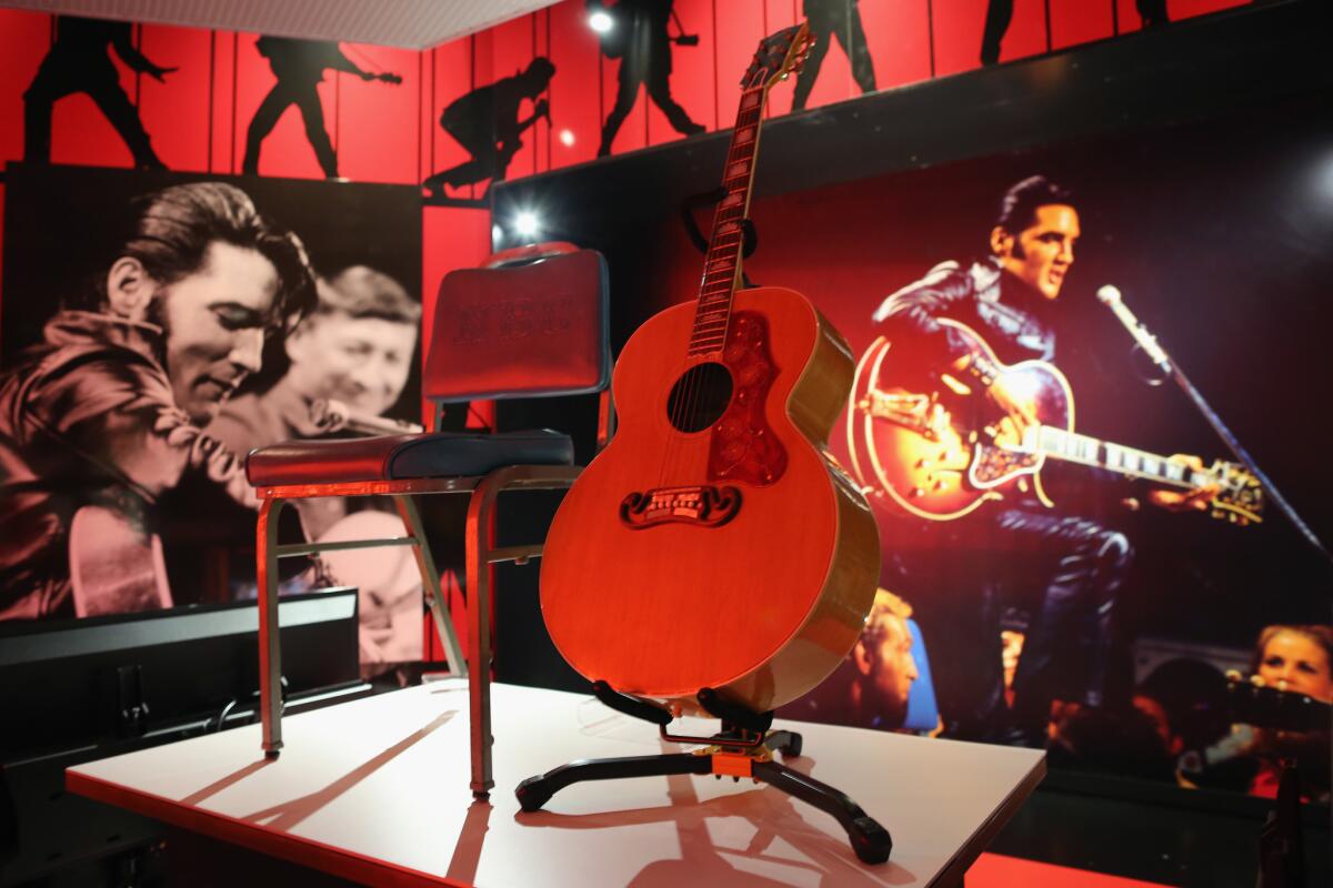 A Gibson J200 guitar from Elvis Presley's 1968 TV special is displayed during a media event for "Elvis at the O2, The Exhibition of His Life" on Dec. 11, 2014, in London.