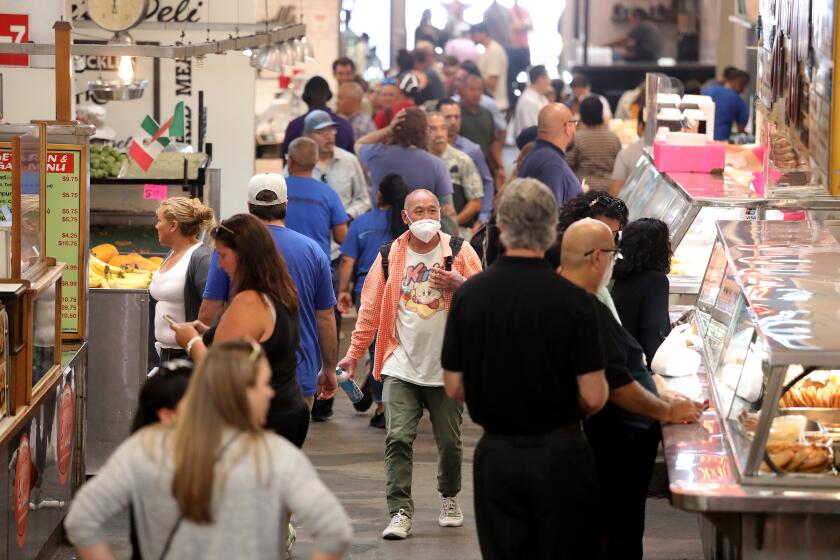LOS ANGELES, CA - AUGUST 31: Lunch time crowd at Grand Central Market on Thursday, Aug. 31, 2023 in Los Angeles, CA. COVID-19 making a comeback in California. (Gary Coronado / Los Angeles Times)